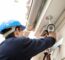 Technician-installing-security-camera