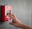 This Is A Photo Of Someone Pulling A Fire Alarm.