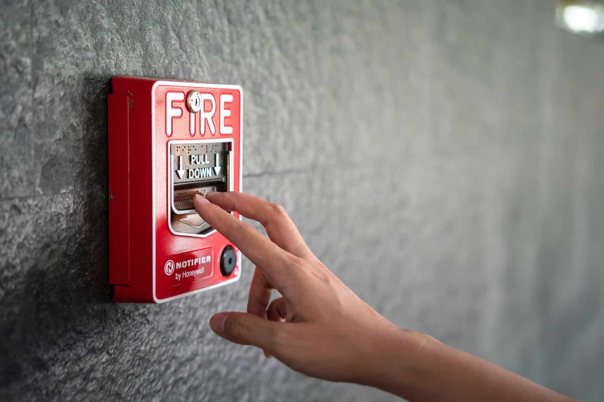 This is a photo of someone pulling a fire alarm.