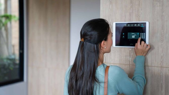 A Woman Arming Her Burglar Alarm